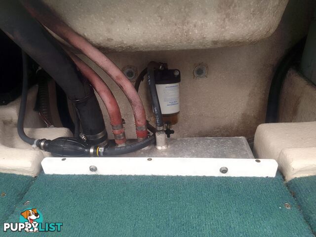 USED 2001 HAINES HUNTER 530 HALF CABIN ON A 2002 TINKA MULTI ROLLER TRAILER WITH A 115HP YAMAHA OUTBOARD.