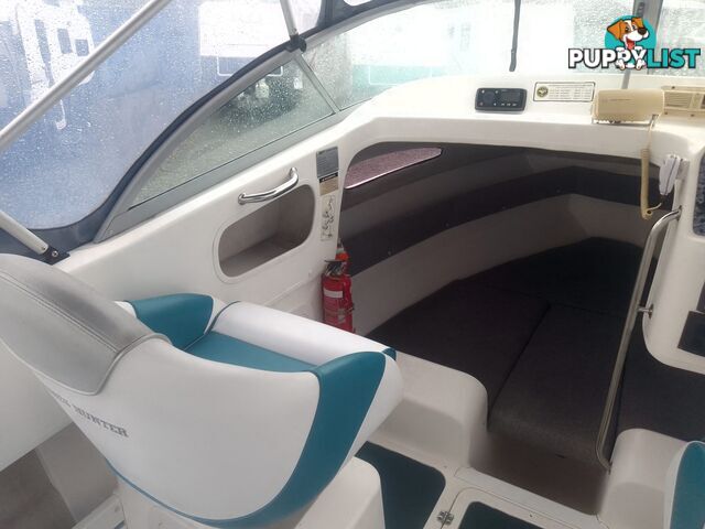 USED 2001 HAINES HUNTER 530 HALF CABIN ON A 2002 TINKA MULTI ROLLER TRAILER WITH A 115HP YAMAHA OUTBOARD.