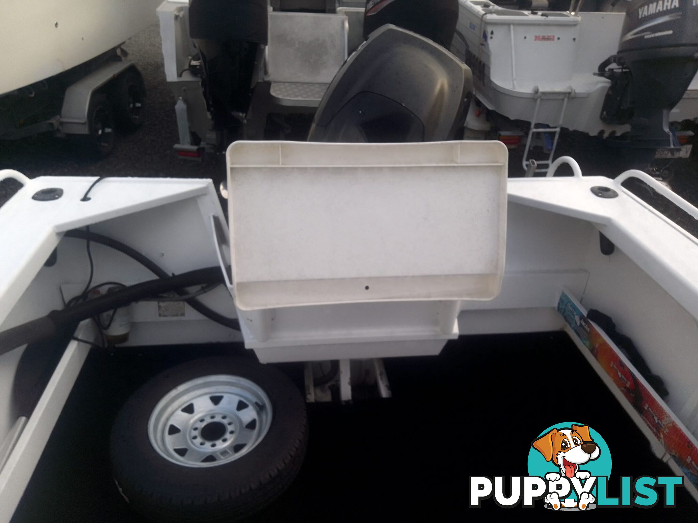 USED 2011 BROOKER DISCOVERY 5M CENTRE CONSOLE WITH A 2007 75HP MERCURY EFI 4 STROKE OUTBOARD ON A 2002 QUINTREX SINGLE AXLE TRAILER.