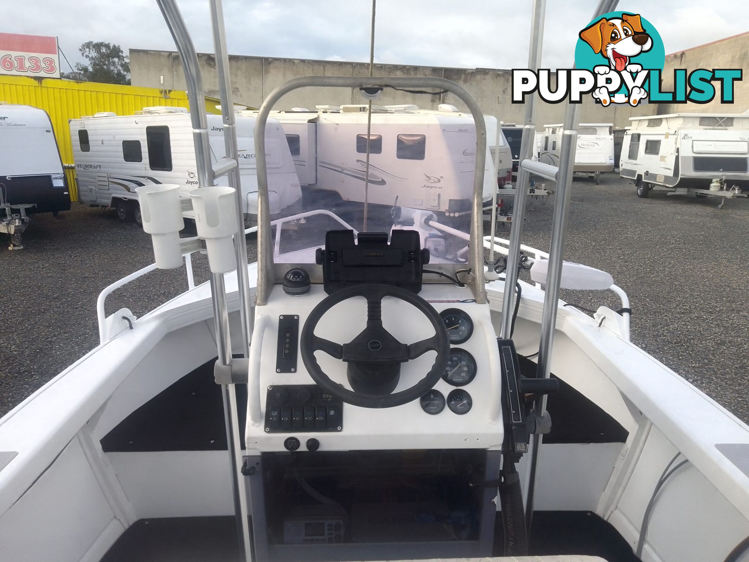 USED 2011 BROOKER DISCOVERY 5M CENTRE CONSOLE WITH A 2007 75HP MERCURY EFI 4 STROKE OUTBOARD ON A 2002 QUINTREX SINGLE AXLE TRAILER.