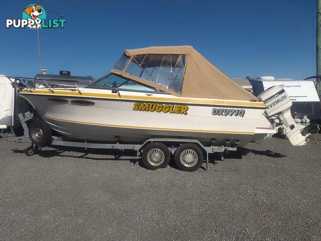 USED 1989 SMUGGLER 6.30 HALF CABIN WITH A 225HP V6 EVINRUDE OUTBOARD ON A 2000 MODEL DUAL AXLE TRAILER.