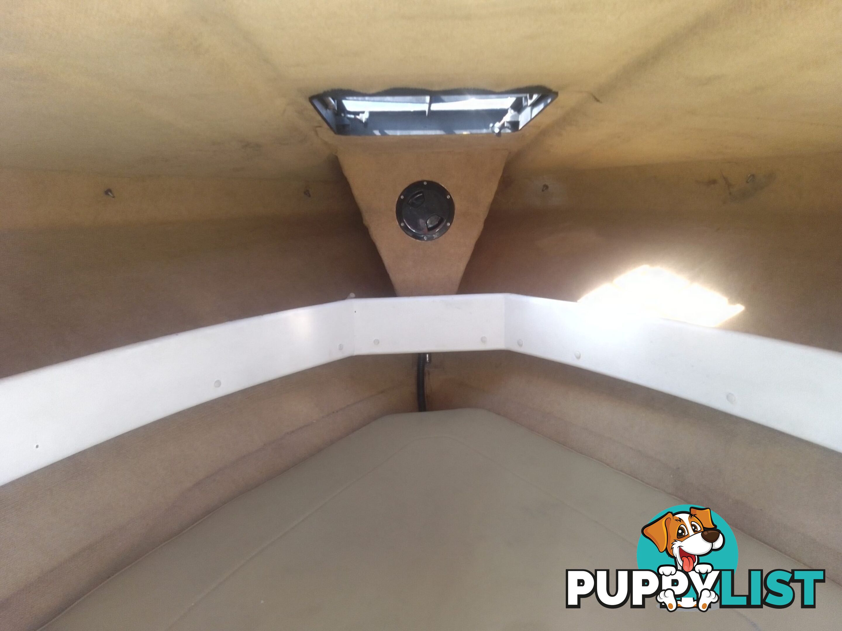 USED 1989 SMUGGLER 6.30 HALF CABIN WITH A 225HP V6 EVINRUDE OUTBOARD ON A 2000 MODEL DUAL AXLE TRAILER.