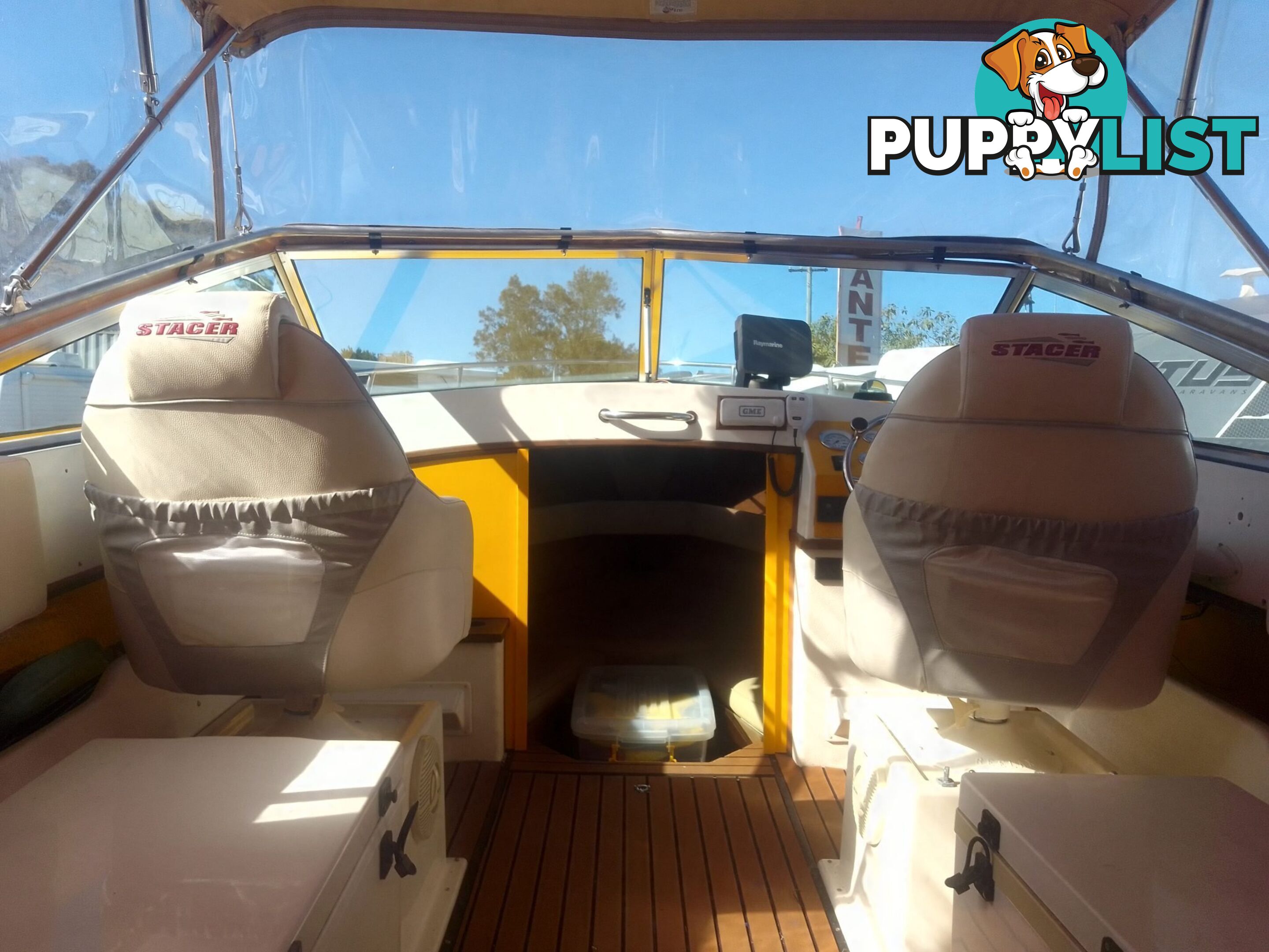 USED 1989 SMUGGLER 6.30 HALF CABIN WITH A 225HP V6 EVINRUDE OUTBOARD ON A 2000 MODEL DUAL AXLE TRAILER.
