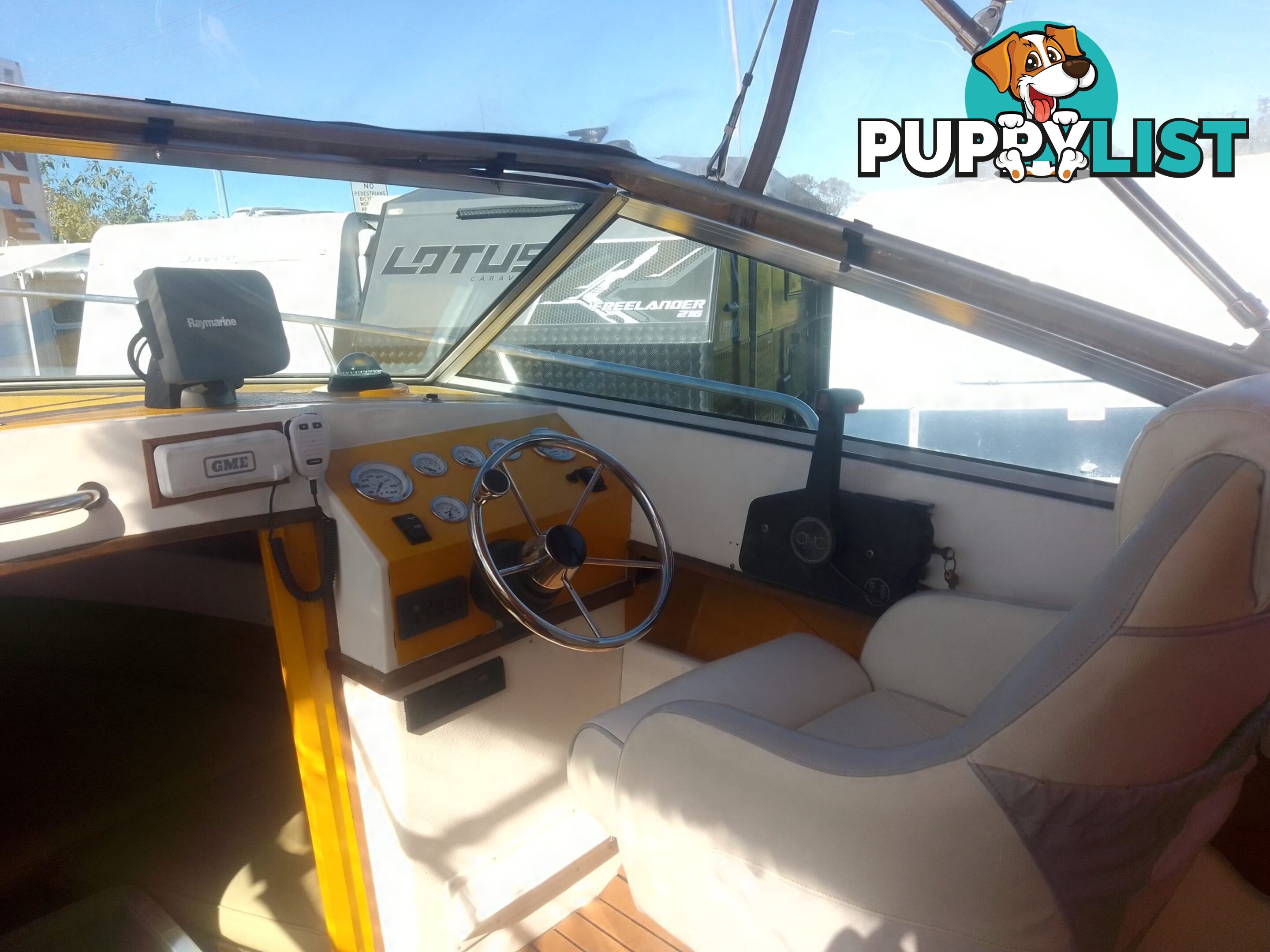 USED 1989 SMUGGLER 6.30 HALF CABIN WITH A 225HP V6 EVINRUDE OUTBOARD ON A 2000 MODEL DUAL AXLE TRAILER.