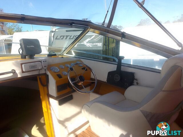 USED 1989 SMUGGLER 6.30 HALF CABIN WITH A 225HP V6 EVINRUDE OUTBOARD ON A 2000 MODEL DUAL AXLE TRAILER.