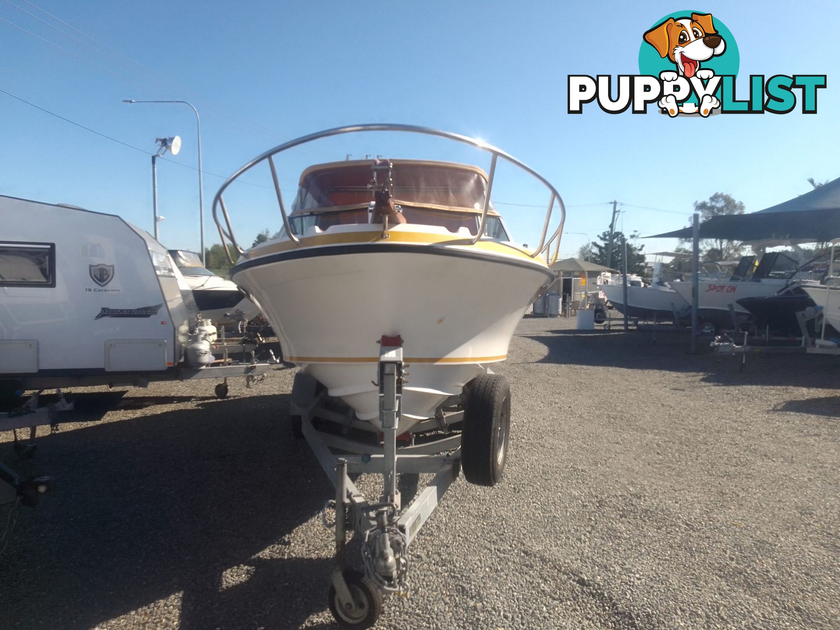 USED 1989 SMUGGLER 6.30 HALF CABIN WITH A 225HP V6 EVINRUDE OUTBOARD ON A 2000 MODEL DUAL AXLE TRAILER.
