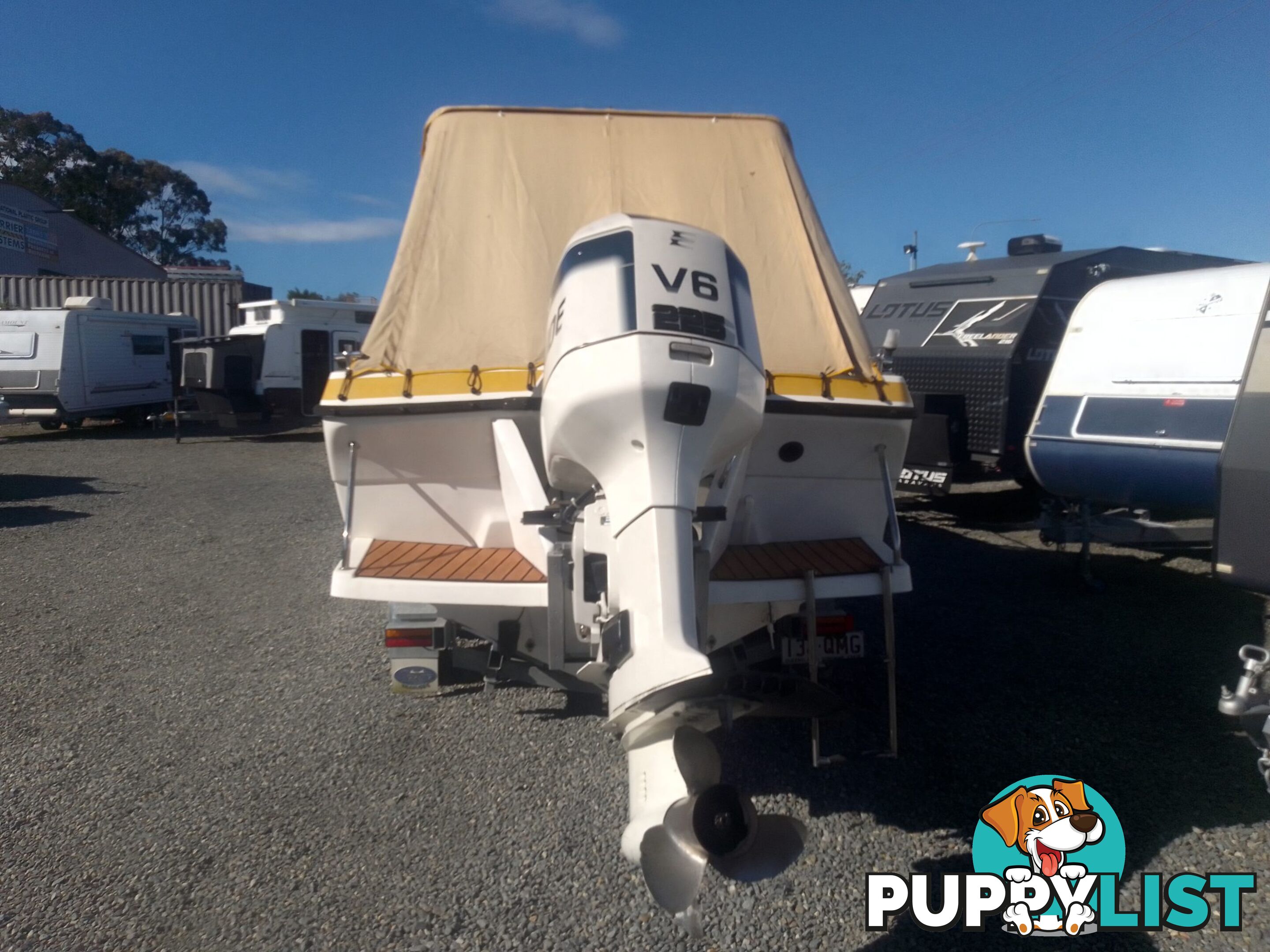 USED 1989 SMUGGLER 6.30 HALF CABIN WITH A 225HP V6 EVINRUDE OUTBOARD ON A 2000 MODEL DUAL AXLE TRAILER.