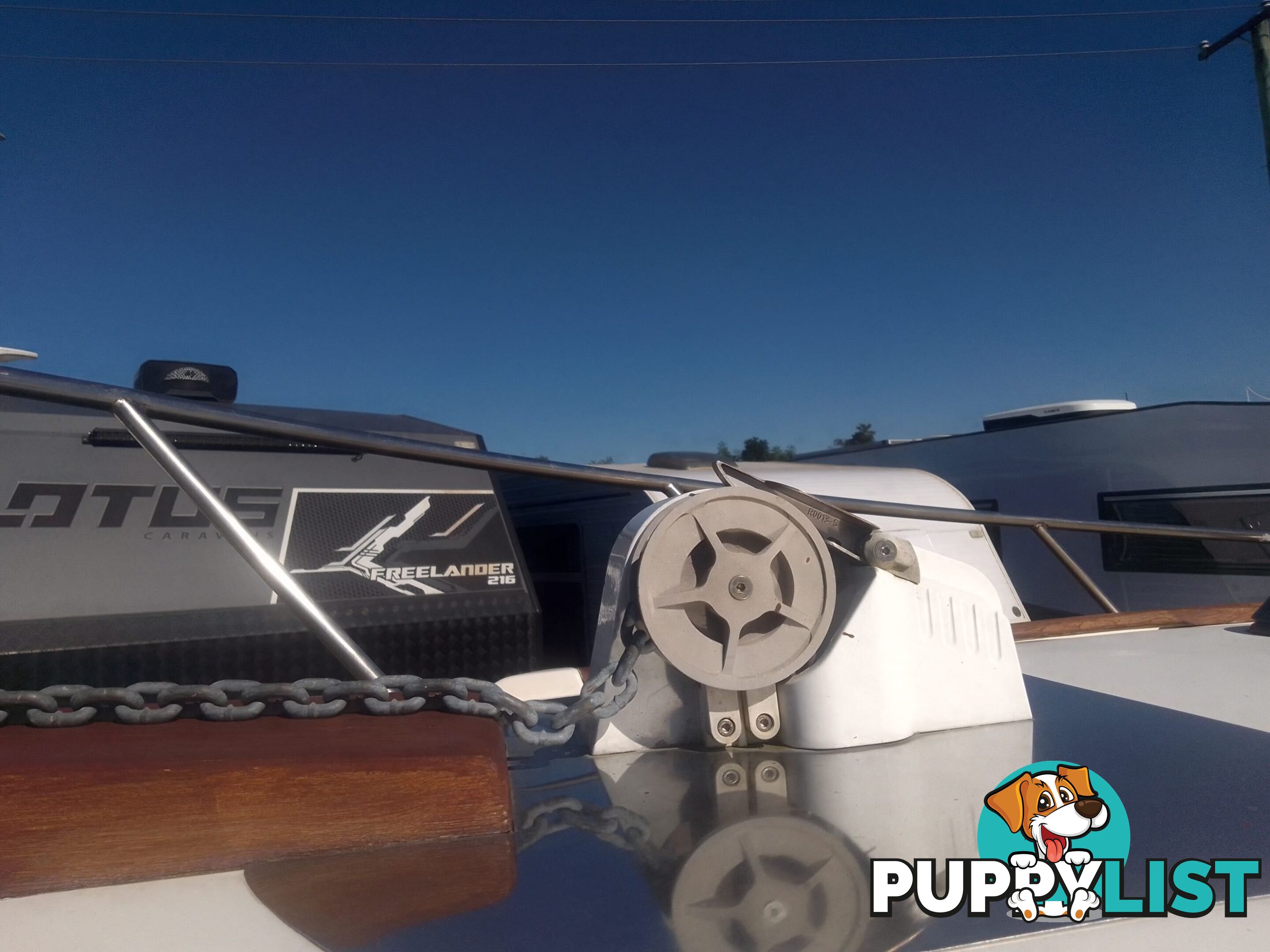USED 1989 SMUGGLER 6.30 HALF CABIN WITH A 225HP V6 EVINRUDE OUTBOARD ON A 2000 MODEL DUAL AXLE TRAILER.