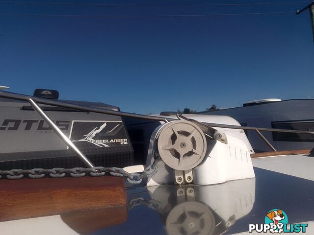 USED 1989 SMUGGLER 6.30 HALF CABIN WITH A 225HP V6 EVINRUDE OUTBOARD ON A 2000 MODEL DUAL AXLE TRAILER.