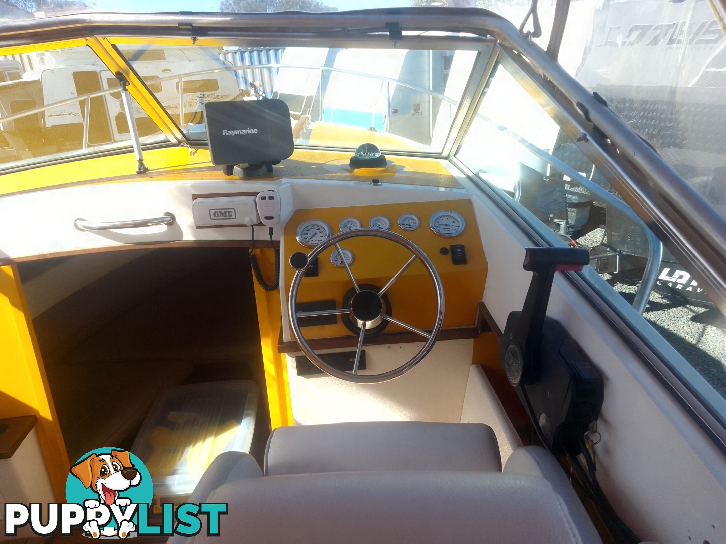 USED 1989 SMUGGLER 6.30 HALF CABIN WITH A 225HP V6 EVINRUDE OUTBOARD ON A 2000 MODEL DUAL AXLE TRAILER.