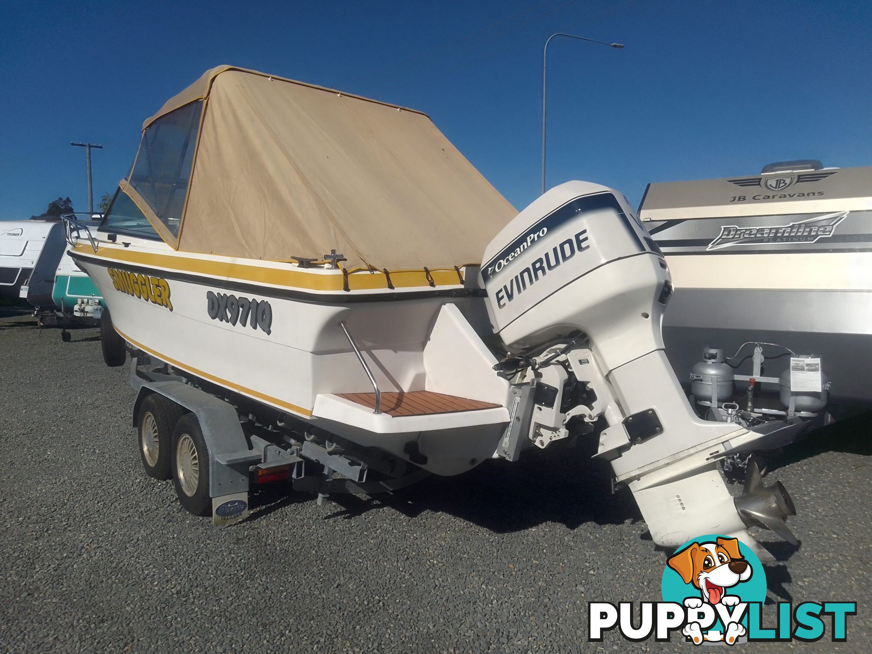 USED 1989 SMUGGLER 6.30 HALF CABIN WITH A 225HP V6 EVINRUDE OUTBOARD ON A 2000 MODEL DUAL AXLE TRAILER.