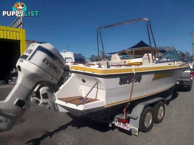 USED 1989 SMUGGLER 6.30 HALF CABIN WITH A 225HP V6 EVINRUDE OUTBOARD ON A 2000 MODEL DUAL AXLE TRAILER.
