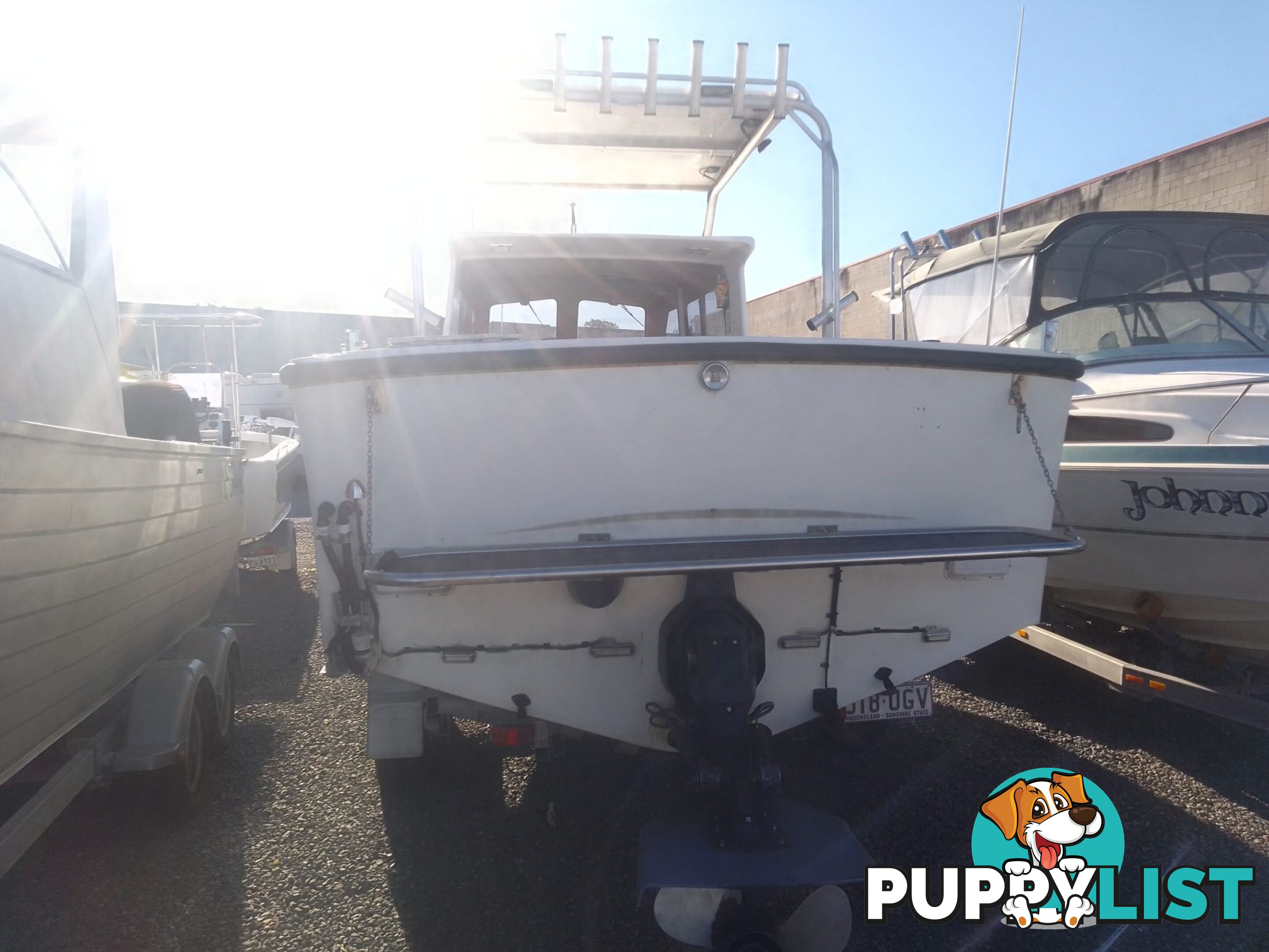 USED 1985 SWIFT CRAFT 7.1M HALF CABIN WTH A 6 CYLINDER MERCRUISER INBOARD DIESEL ENGINE ON A CUSTOM DUAL AXLE TRAILER
