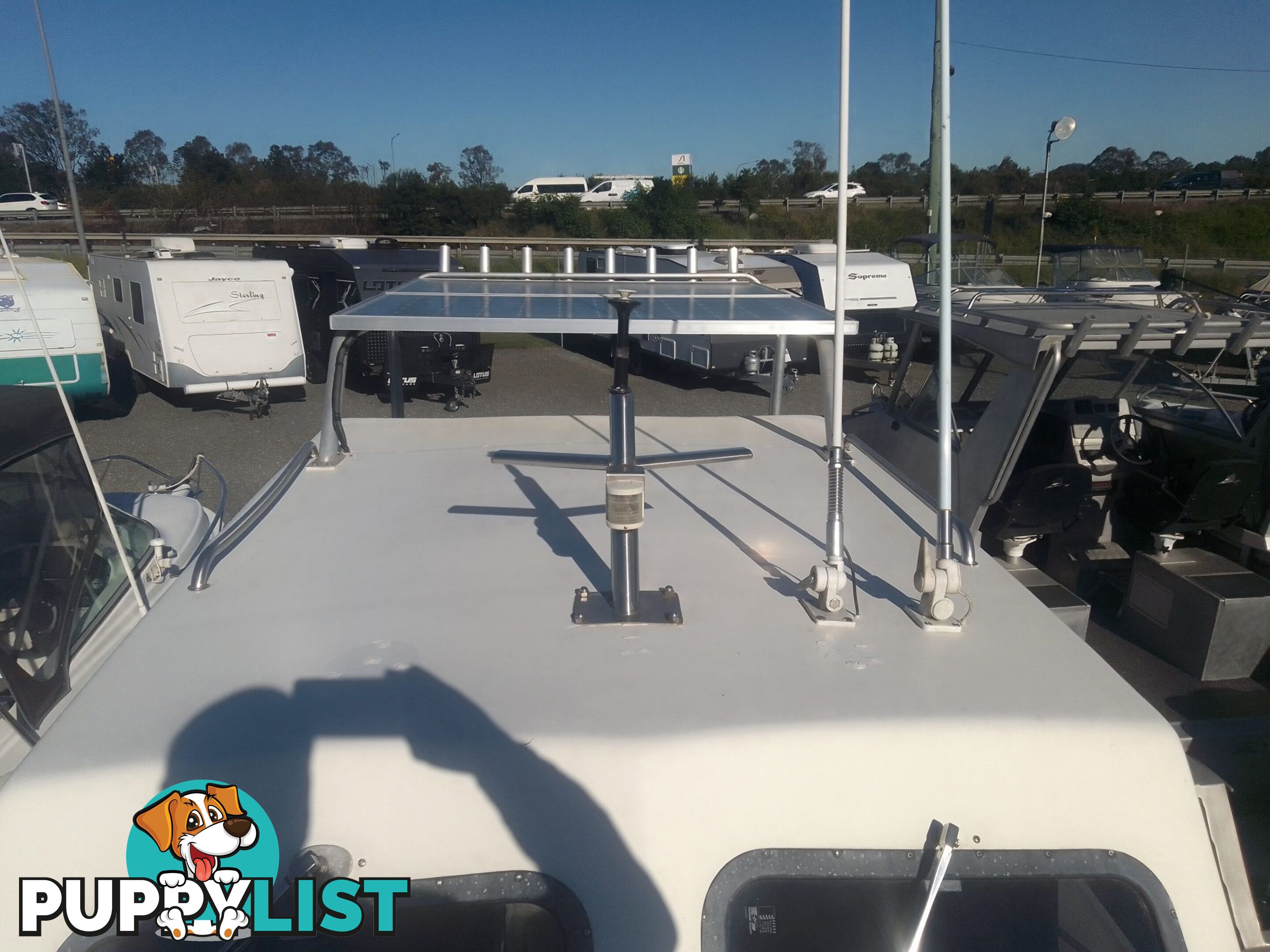 USED 1985 SWIFT CRAFT 7.1M HALF CABIN WTH A 6 CYLINDER MERCRUISER INBOARD DIESEL ENGINE ON A CUSTOM DUAL AXLE TRAILER