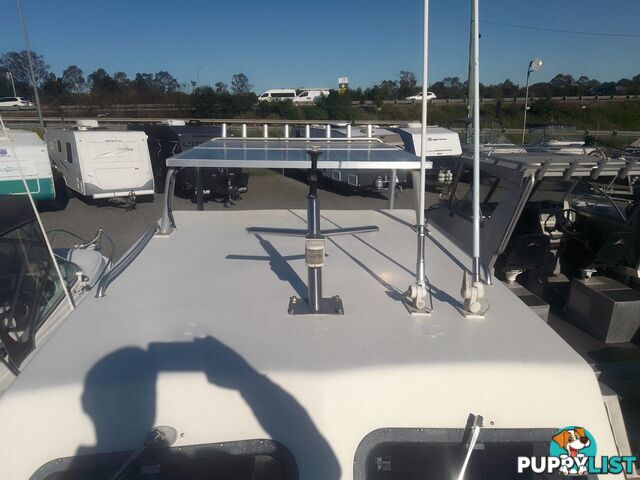 USED 1985 SWIFT CRAFT 7.1M HALF CABIN WTH A 6 CYLINDER MERCRUISER INBOARD DIESEL ENGINE ON A CUSTOM DUAL AXLE TRAILER