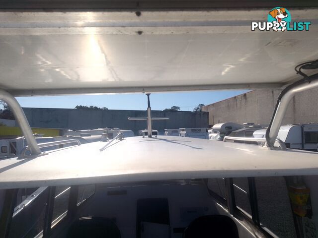 USED 1985 SWIFT CRAFT 7.1M HALF CABIN WTH A 6 CYLINDER MERCRUISER INBOARD DIESEL ENGINE ON A CUSTOM DUAL AXLE TRAILER
