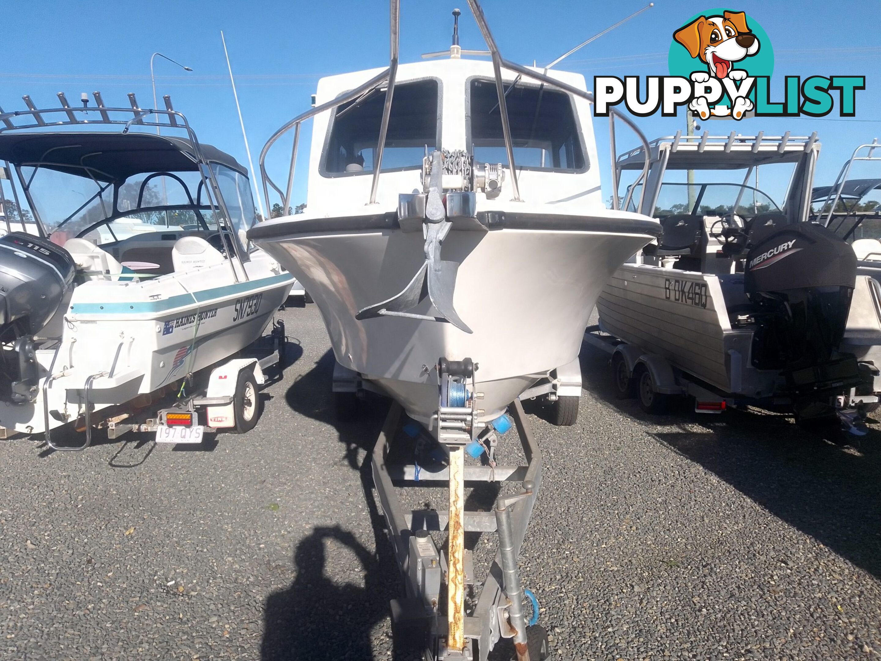 USED 1985 SWIFT CRAFT 7.1M HALF CABIN WTH A 6 CYLINDER MERCRUISER INBOARD DIESEL ENGINE ON A CUSTOM DUAL AXLE TRAILER
