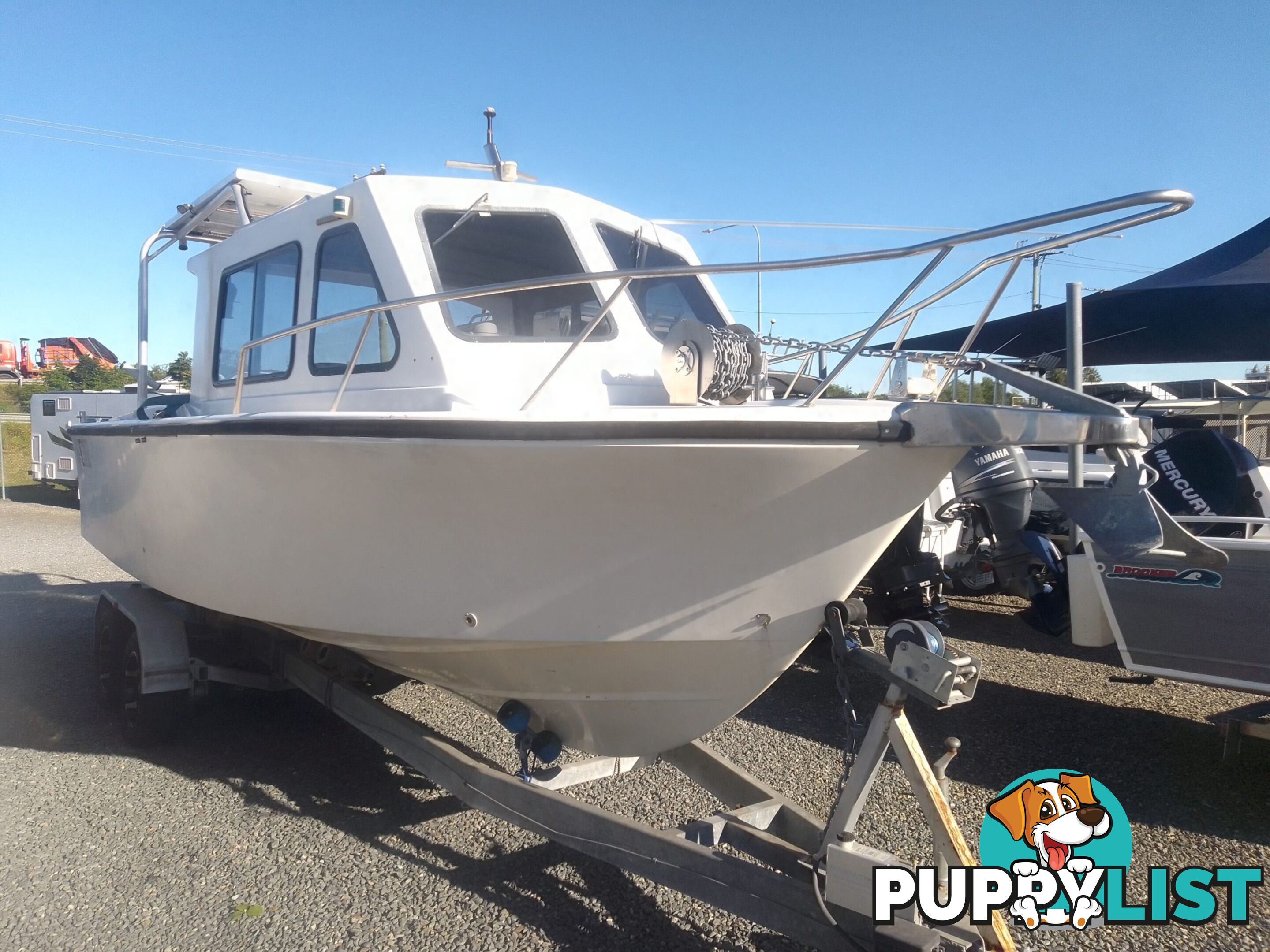USED 1985 SWIFT CRAFT 7.1M HALF CABIN WTH A 6 CYLINDER MERCRUISER INBOARD DIESEL ENGINE ON A CUSTOM DUAL AXLE TRAILER