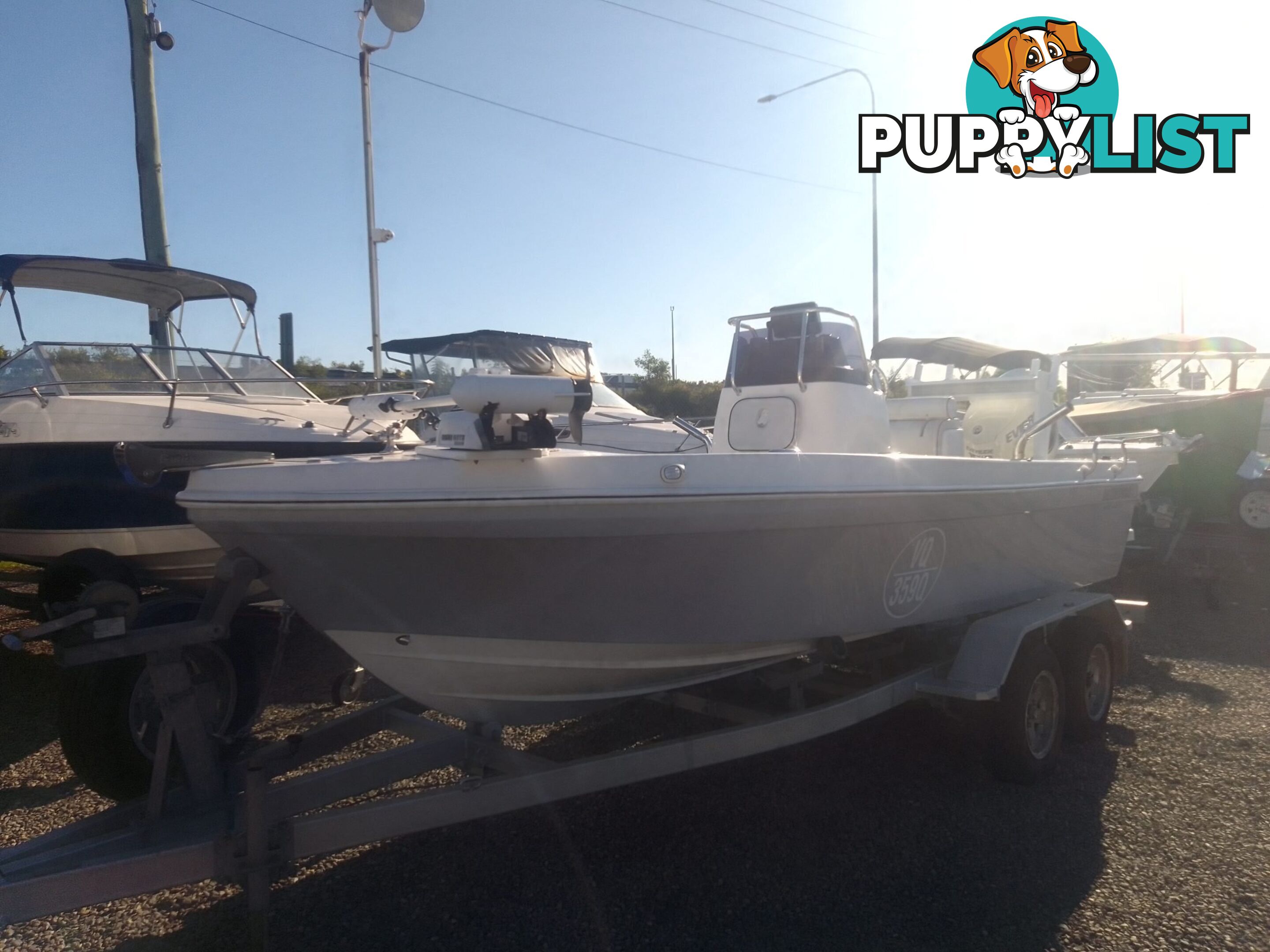 USED 2012 BONITO 560 CENTRE CONSOLE WITH A 2016 150HP EVINRUDE ETEC OUTBOARD ON A 2016 MAYFAIR MARINE DUAL AXLE TRAILER