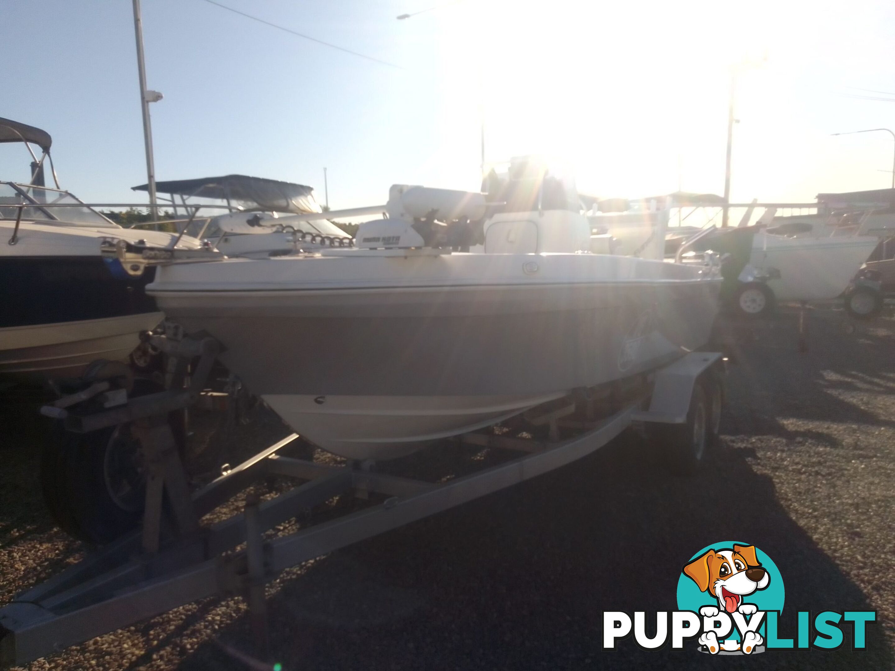 USED 2012 BONITO 560 CENTRE CONSOLE WITH A 2016 150HP EVINRUDE ETEC OUTBOARD ON A 2016 MAYFAIR MARINE DUAL AXLE TRAILER