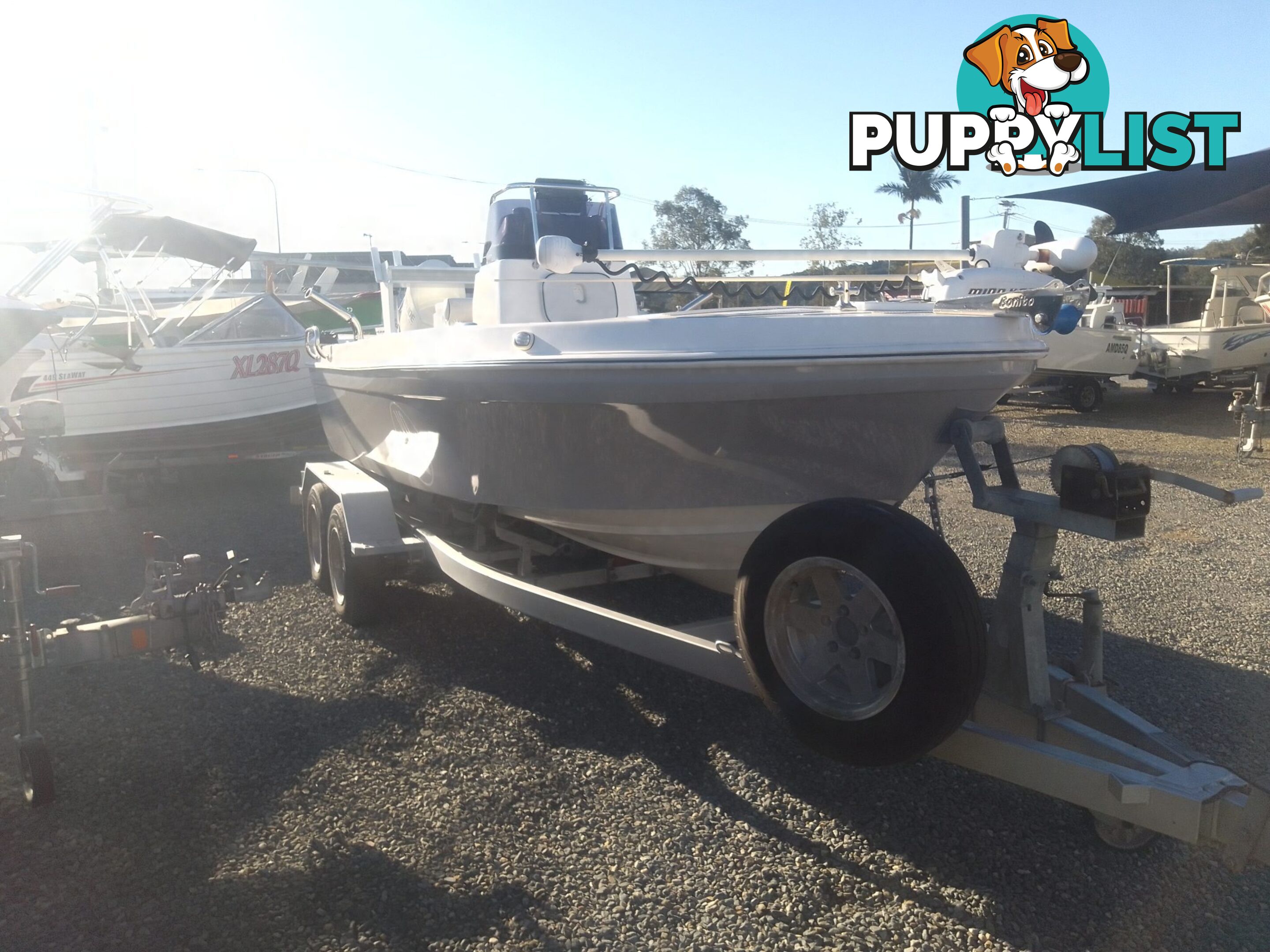 USED 2012 BONITO 560 CENTRE CONSOLE WITH A 2016 150HP EVINRUDE ETEC OUTBOARD ON A 2016 MAYFAIR MARINE DUAL AXLE TRAILER