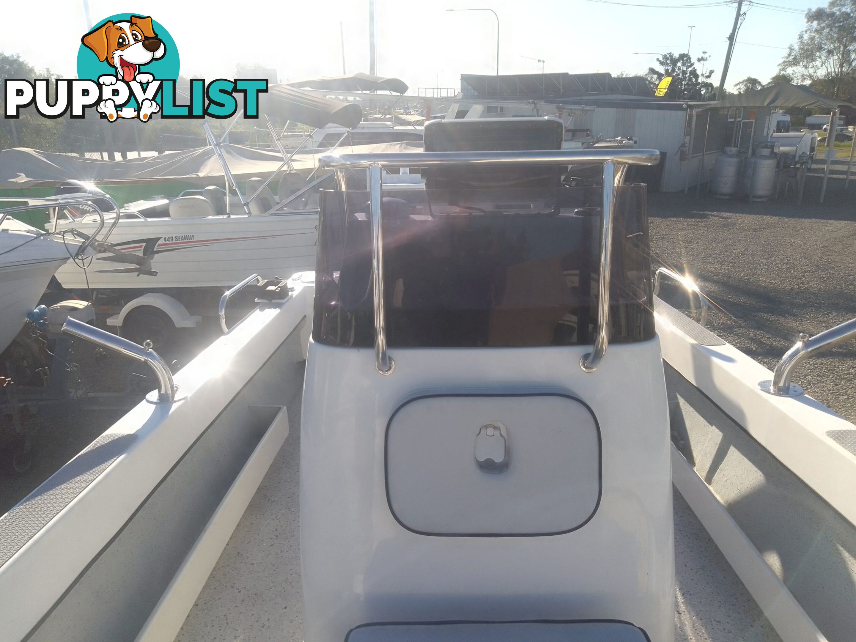 USED 2012 BONITO 560 CENTRE CONSOLE WITH A 2016 150HP EVINRUDE ETEC OUTBOARD ON A 2016 MAYFAIR MARINE DUAL AXLE TRAILER