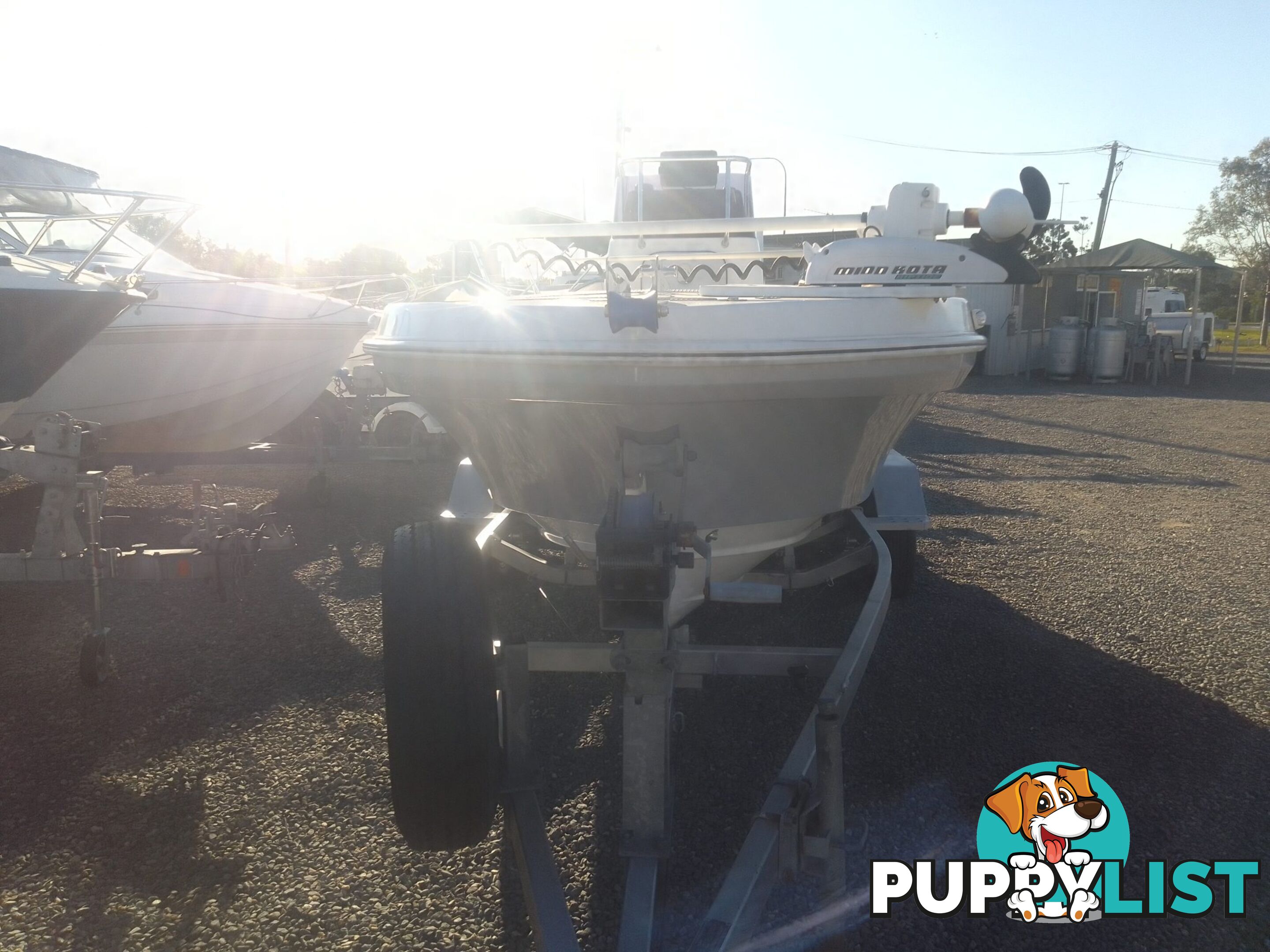 USED 2012 BONITO 560 CENTRE CONSOLE WITH A 2016 150HP EVINRUDE ETEC OUTBOARD ON A 2016 MAYFAIR MARINE DUAL AXLE TRAILER