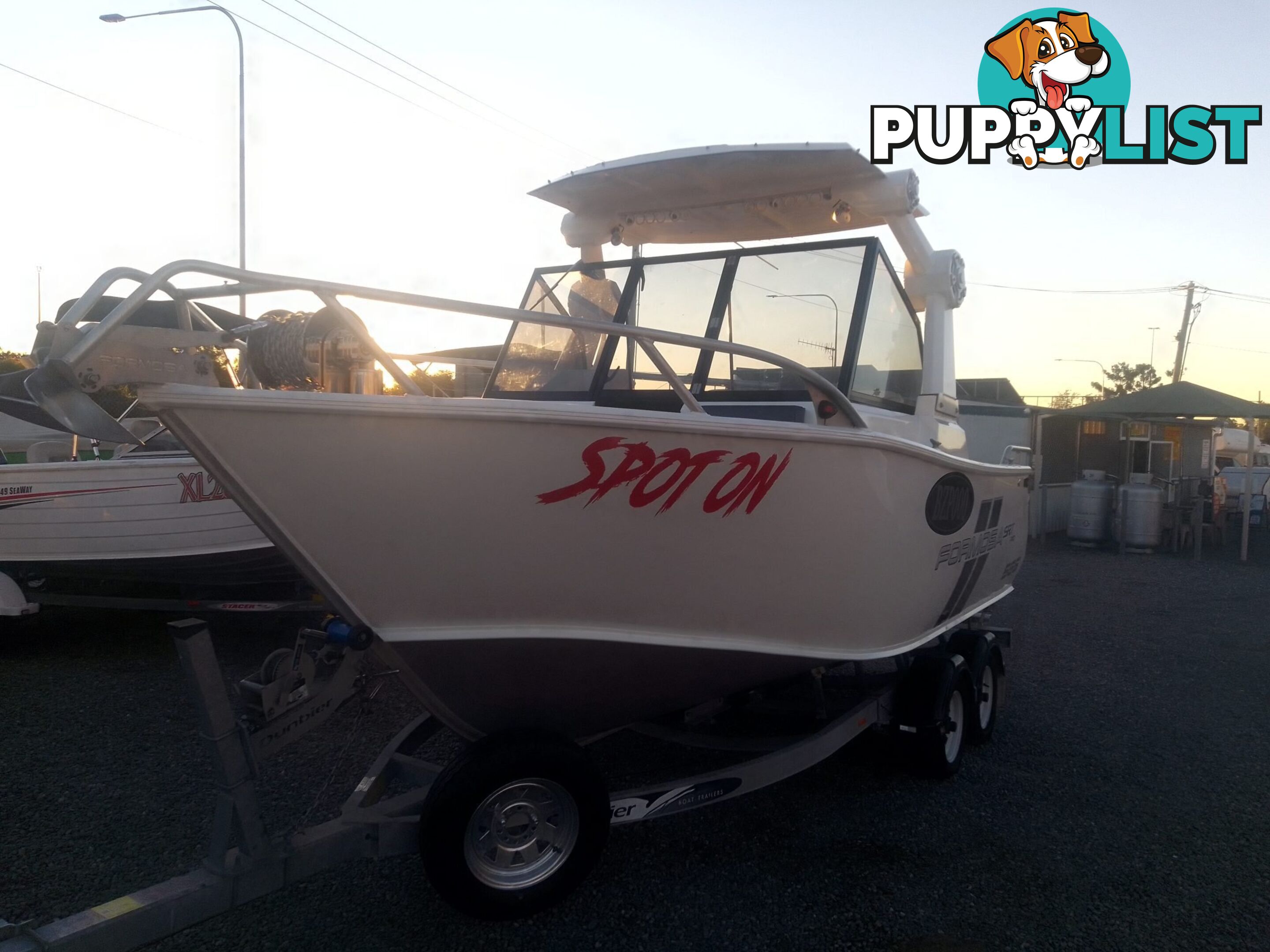 USED 2022 FORMOSA SRT PRO 565 CENTRE CONSOLE ON A 2022 DUNBIER DUAL AXLE TRAILER WITH A 2022 SUZUKI 4 STROKE 175HP OUTBOARD