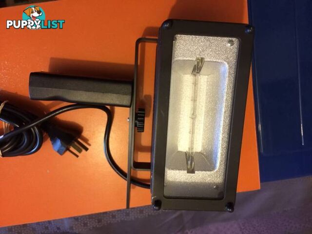 Powerful hand held studio light by UNOMAT in near new condition