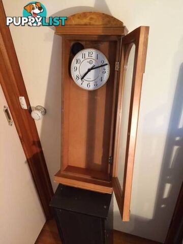 WALL MOUNTED CLOCK IN WOODEN CASE WITH GLASS DOOR