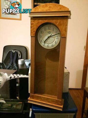 WALL MOUNTED CLOCK IN WOODEN CASE WITH GLASS DOOR