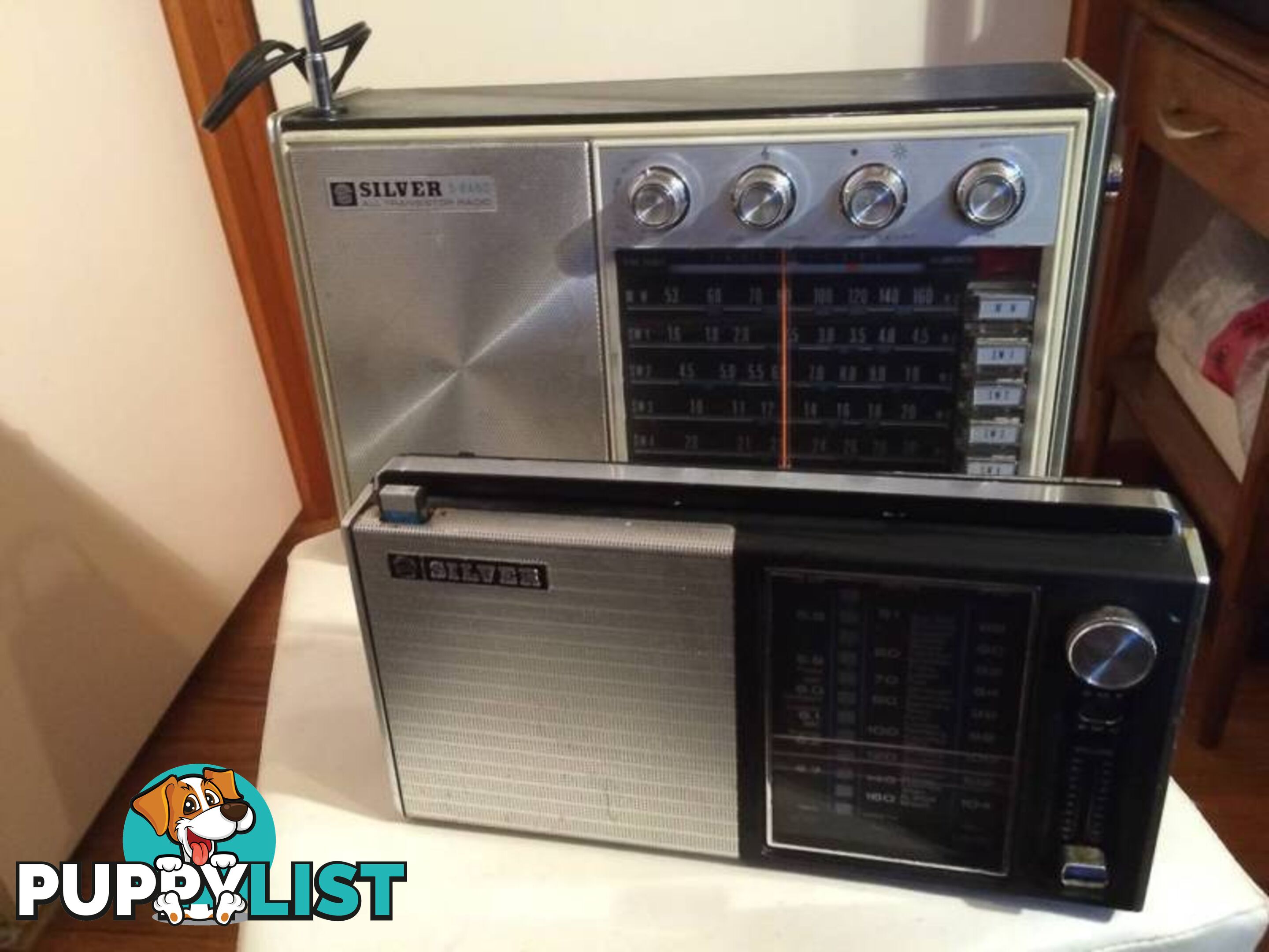 A PAIR OF SILVER VINTAGE RADIOS IN WORKING CONDITION