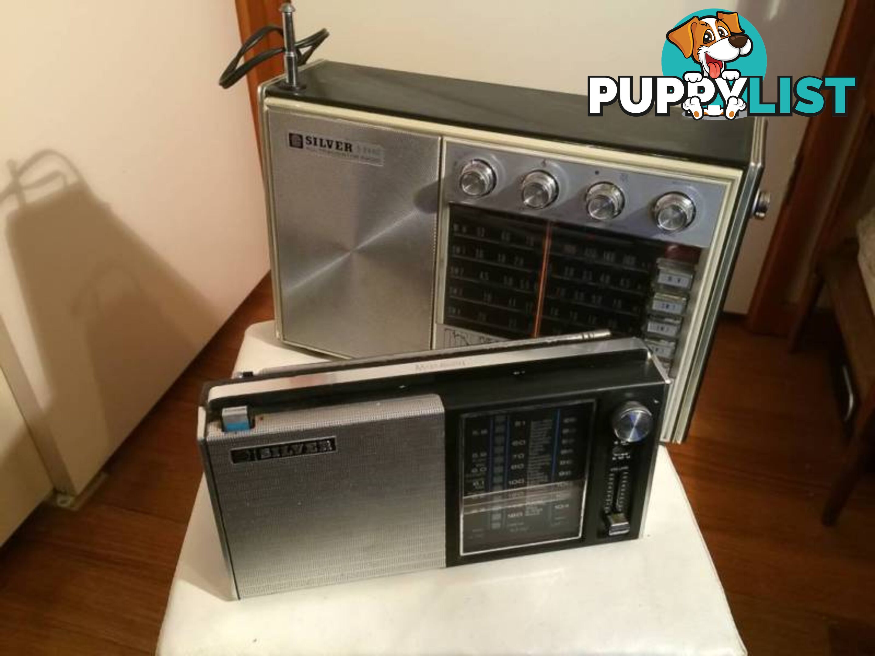 A PAIR OF SILVER VINTAGE RADIOS IN WORKING CONDITION