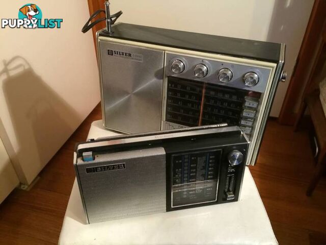 A PAIR OF SILVER VINTAGE RADIOS IN WORKING CONDITION