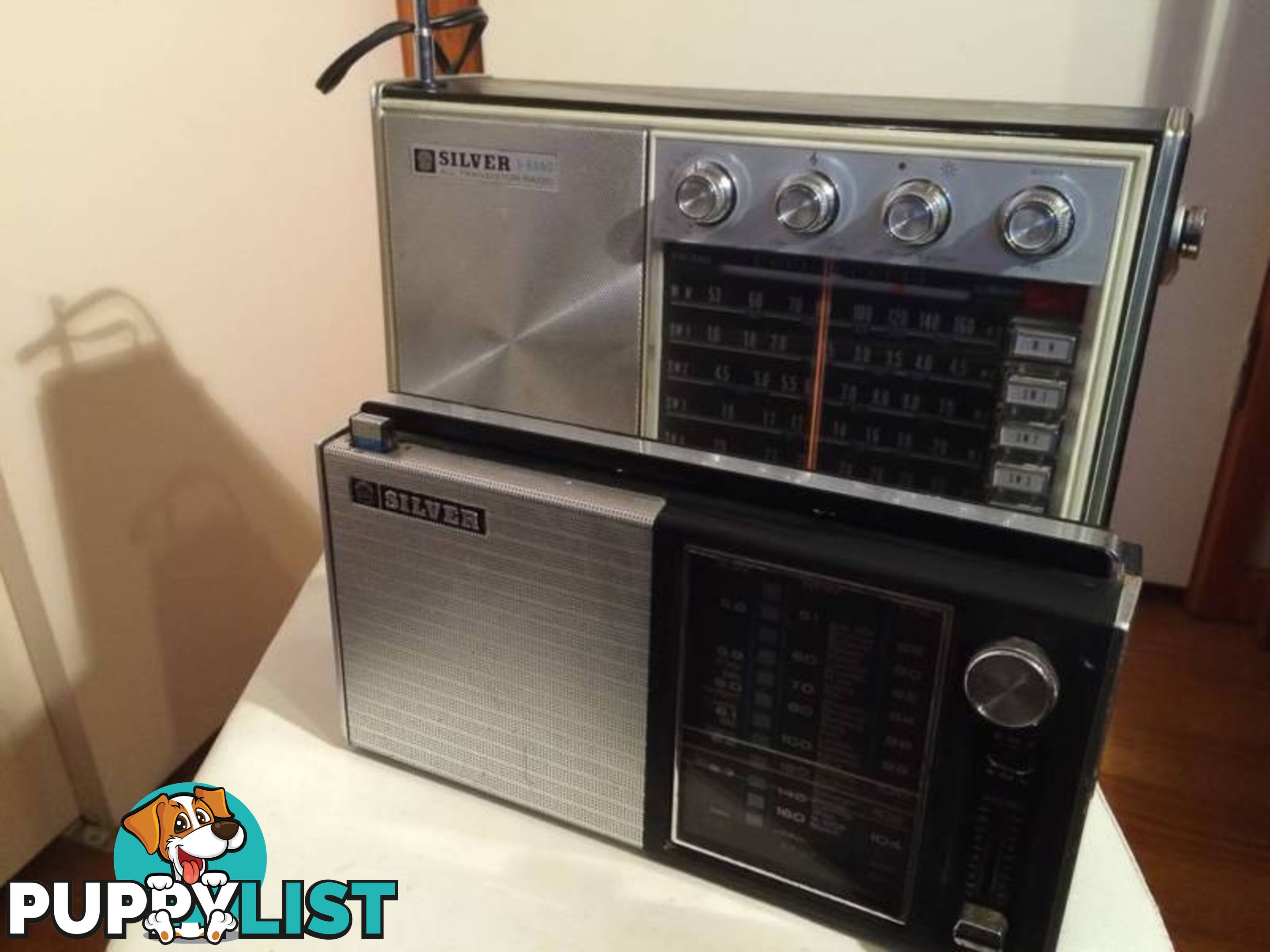 A PAIR OF SILVER VINTAGE RADIOS IN WORKING CONDITION