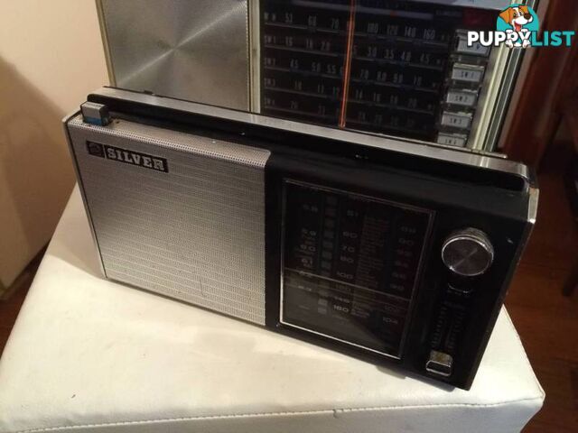 A PAIR OF SILVER VINTAGE RADIOS IN WORKING CONDITION