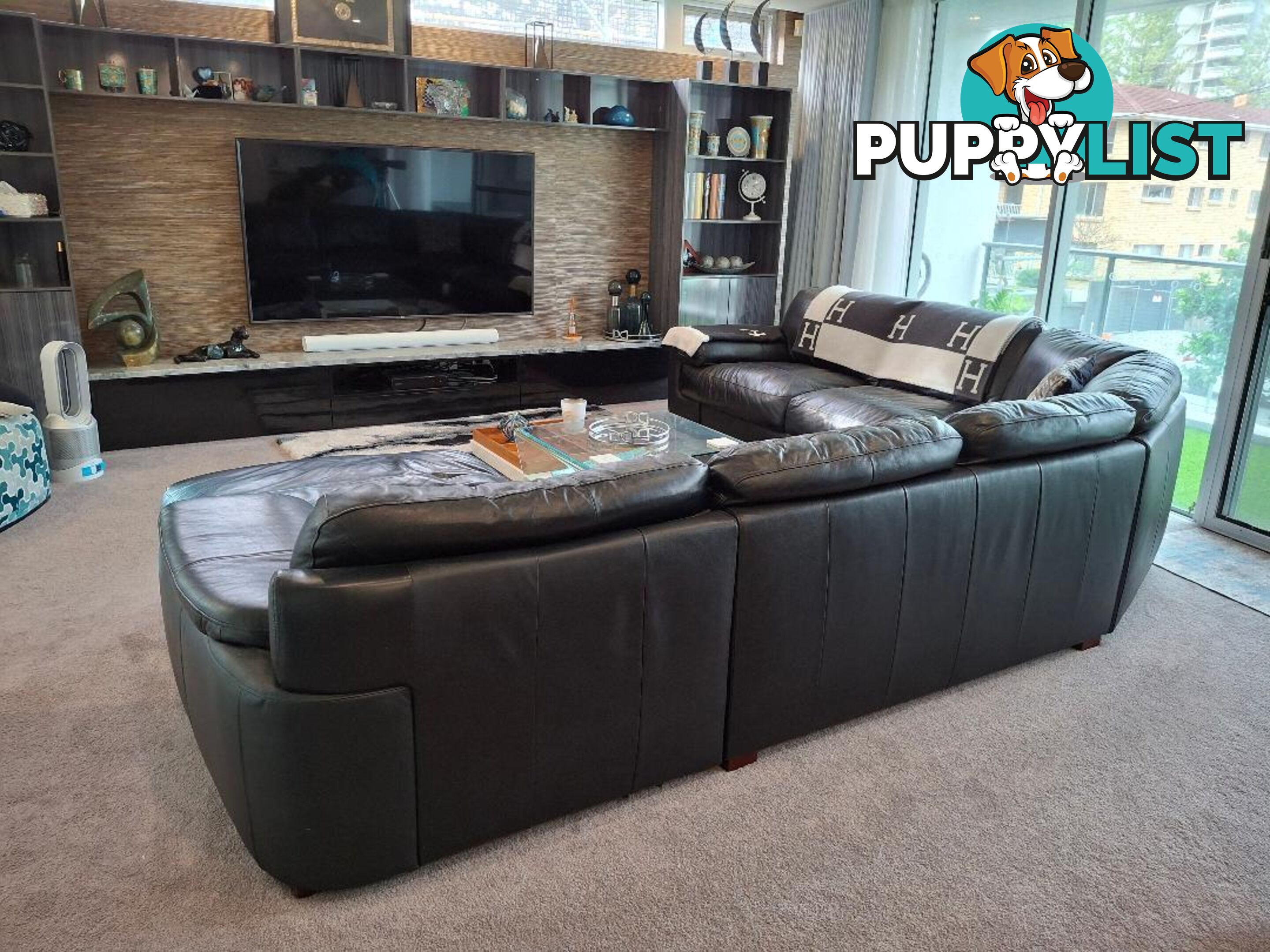 This beautiful Genuine Black Leather 6  seater Couch is very comfy and big. 0408985133