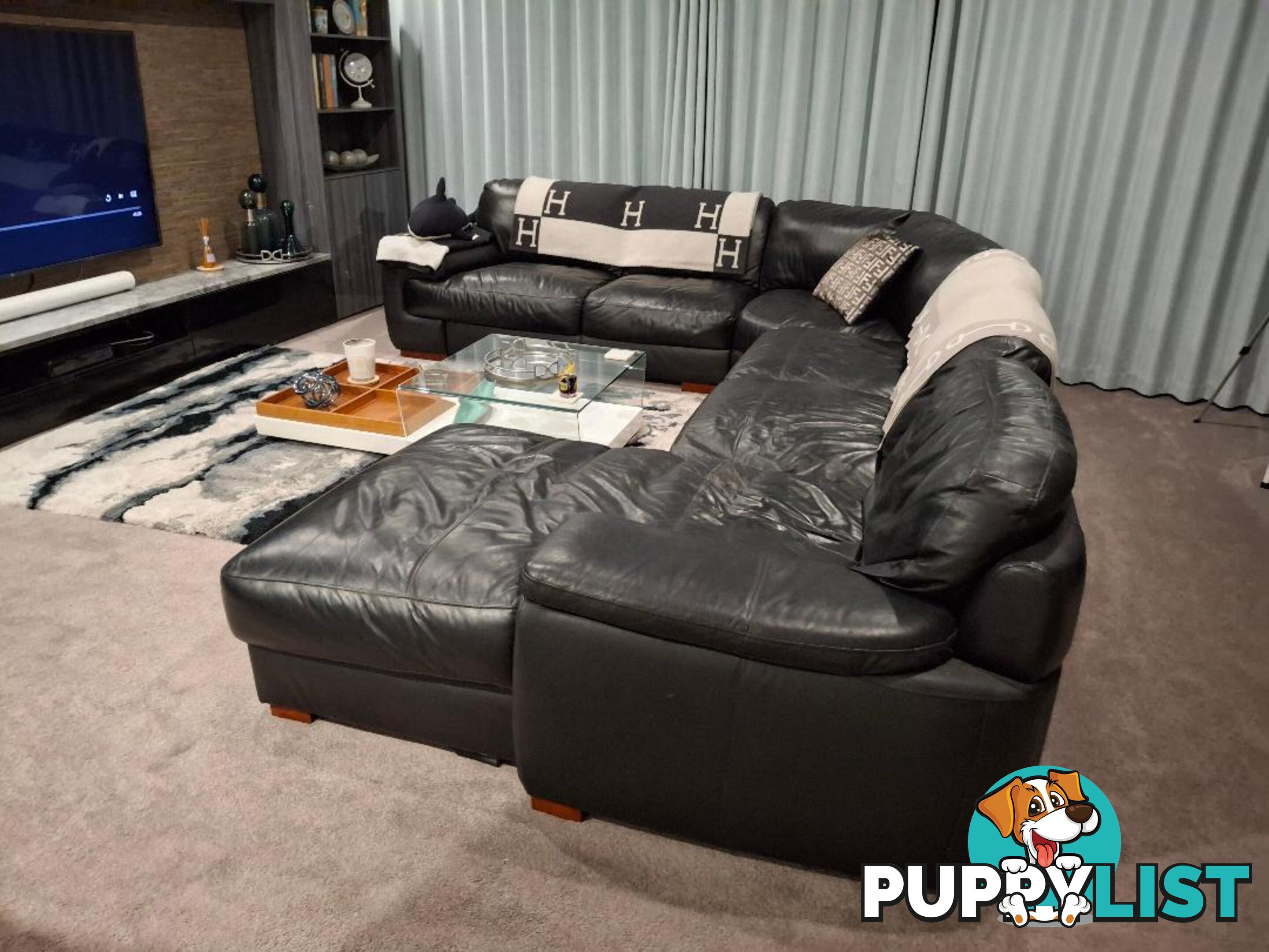 This beautiful Genuine Black Leather 6  seater Couch is very comfy and big. 0408985133
