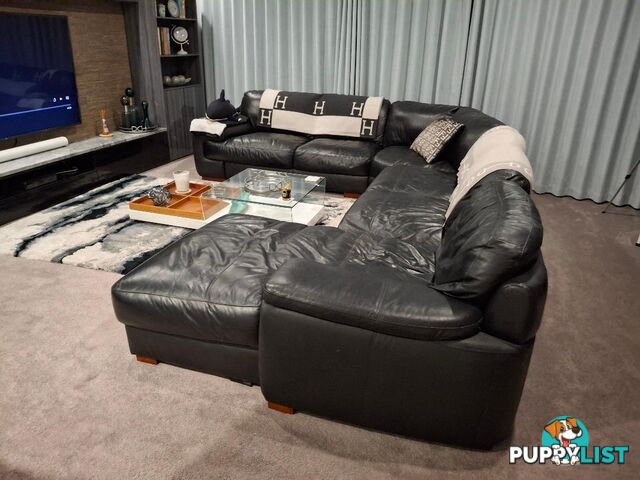 This beautiful Genuine Black Leather 6  seater Couch is very comfy and big. 0408985133