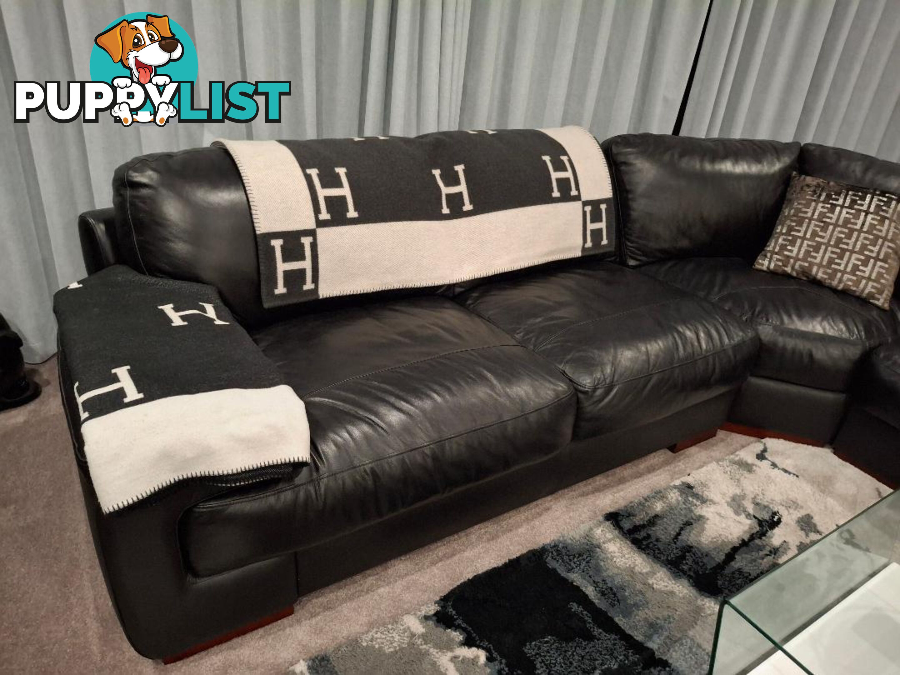 This beautiful Genuine Black Leather 6  seater Couch is very comfy and big. 0408985133