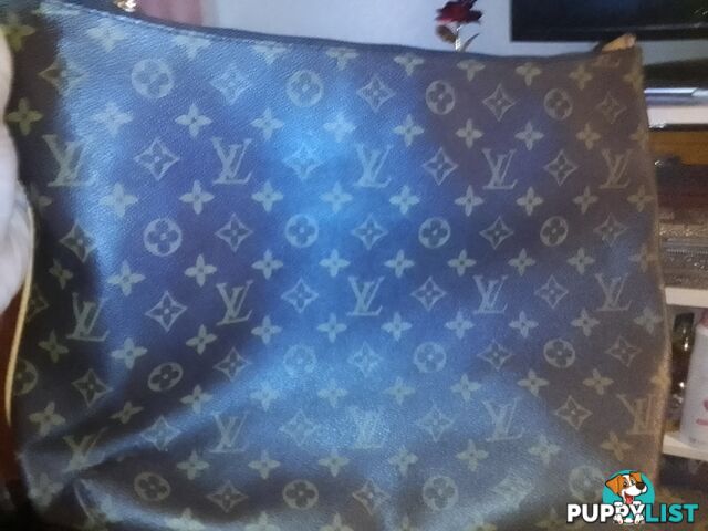 Genuine lui Vuitton clutch bag