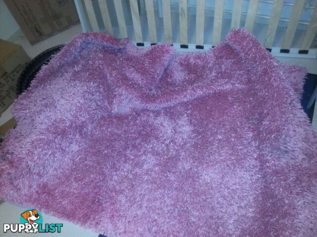 pink shaggy rug