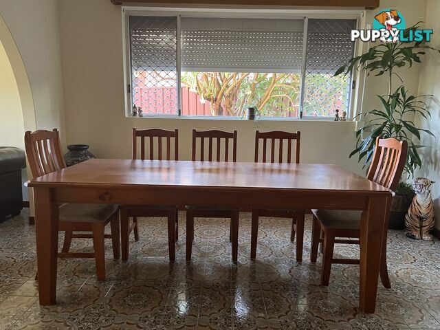 Timber dining table and 8 chairs