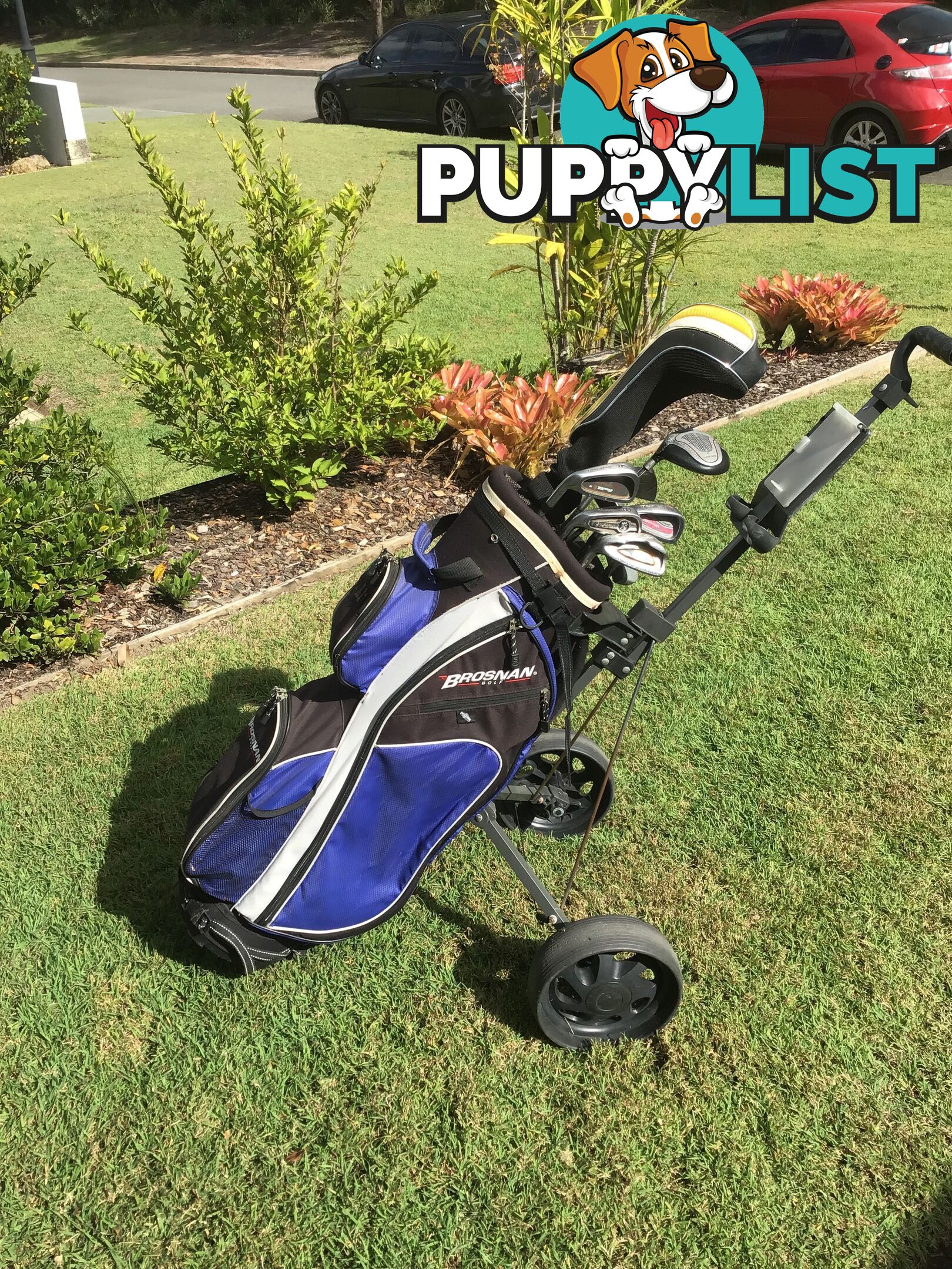 Left handed golf clubs, bag and trolley