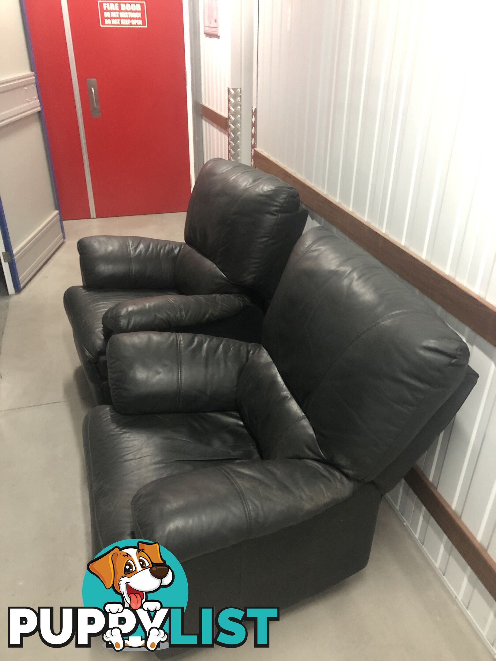 Two Black leather recliner chairs