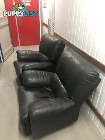 Two Black leather recliner chairs