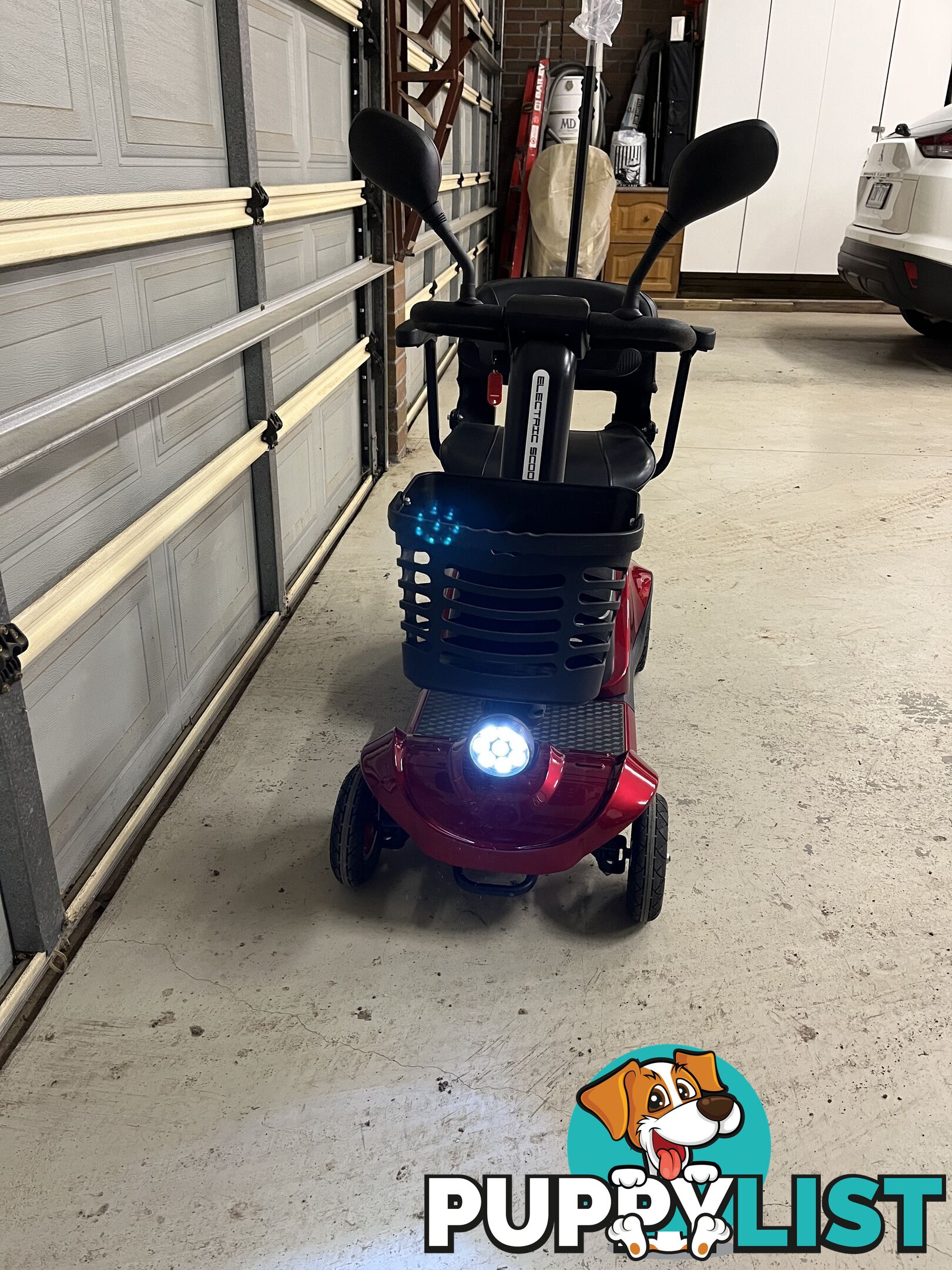 Red Mobility Scooter with Umbrella