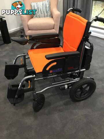 Merits Classic E-Power Wheelchair. As new. Will deliver. Reduced to sell