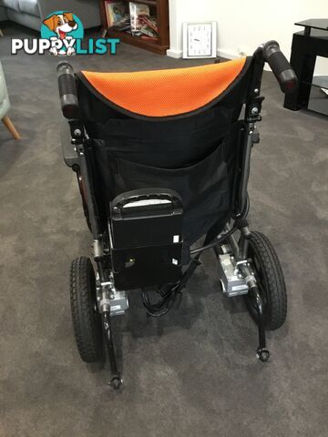 Merits Classic E-Power Wheelchair. As new. Will deliver. Reduced to sell