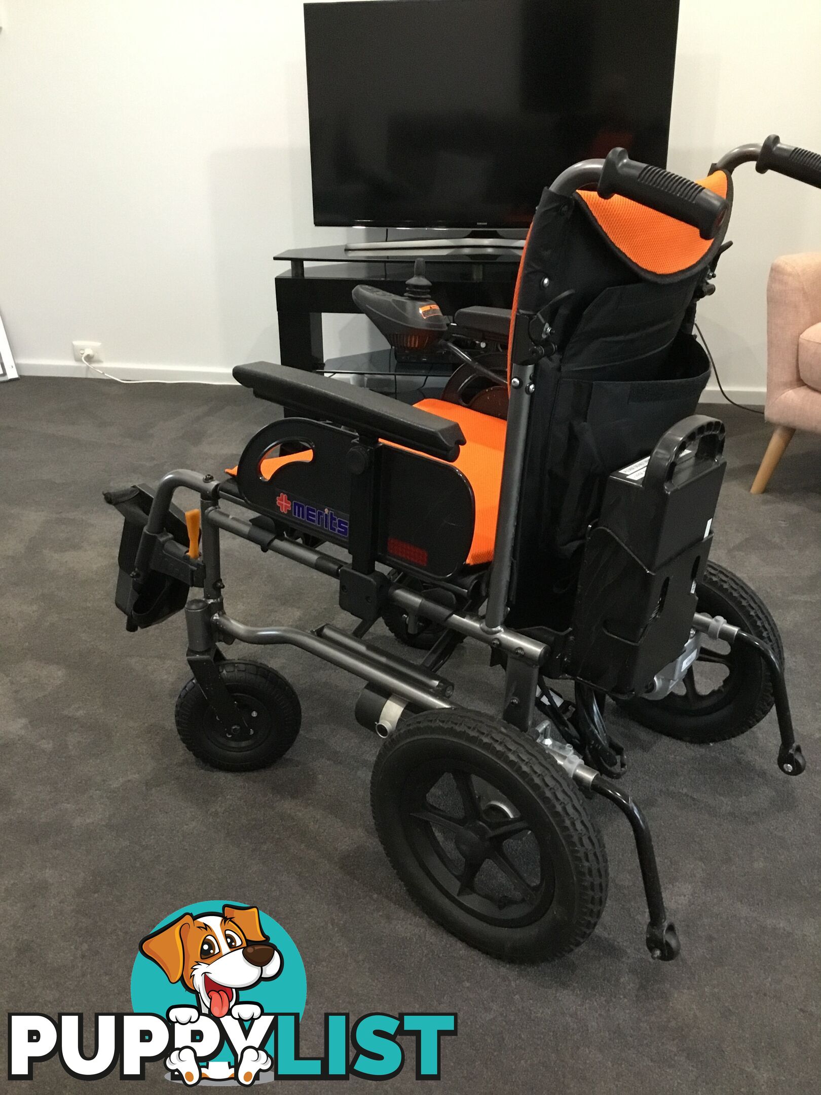 Merits Classic E-Power Wheelchair. As new. Will deliver. Reduced to sell